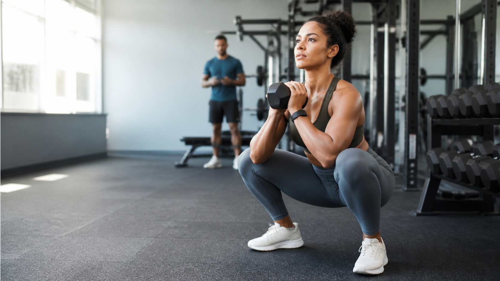 Gym workout routine for beginners featuring a dumbbell goblet squat